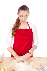 Image showing beautiful woman is baking cookies for christmas