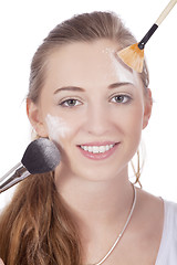 Image showing young beautiful woman applying mineral powder 