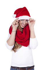 Image showing young beautiful woman with red scarf and christmas hat