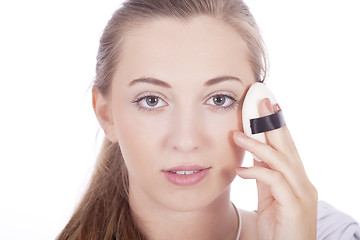 Image showing young beautiful woman applying mineral powder 