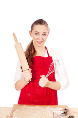 Image showing beautiful woman is baking cookies for christmas