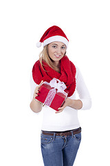 Image showing young smiling girl with red hat and present christmas