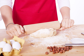 Image showing beautiful woman is baking cookies for christmas