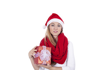 Image showing young smiling girl with red hat and present christmas