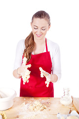 Image showing beautiful woman is baking cookies for christmas