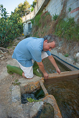 Image showing Getting water