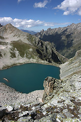 Image showing Lake in mountains. Alpine latitudes at different times of the ye