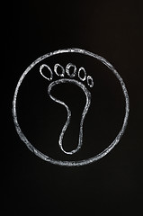 Image showing Chalk drawing of footprint symbol on blackboard background