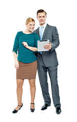 Image showing Businessman using tablet pc with secretary beside