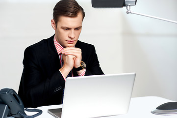 Image showing Serious businessman concentrating