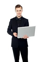 Image showing Casual young man with laptop