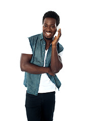 Image showing African teen boy enjoying music