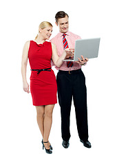 Image showing Female secretary pointing into laptop