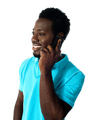 Image showing African guy communicating via cellphone