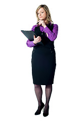 Image showing Corporate woman reading official documents