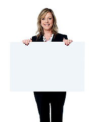 Image showing Female executive showing an advertising board