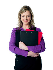 Image showing Beautiful smiling woman holding documents