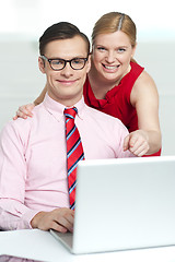 Image showing Corporate couple enjoying videos on laptop
