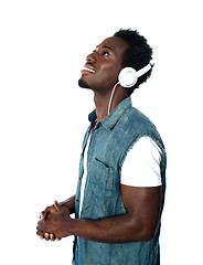 Image showing African guy lost in musical world