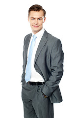 Image showing Smiling entrepreneur posing with hands in pocket