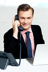 Image showing Smart businessman communicating on phone