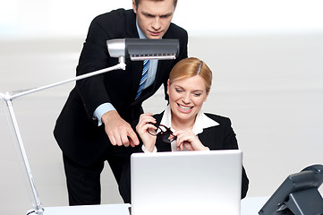 Image showing Man pointing finger at laptop screen