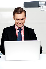 Image showing Business male watching videos on laptop