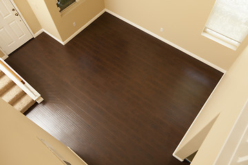 Image showing Newly Installed Brown Laminate Flooring and Baseboards in Home