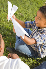 Image showing Mixed Race Father and Son Playing with Paper Airplanes