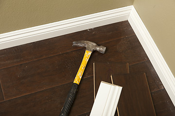 Image showing Hammer, Laminate Flooring and New Baseboard Molding