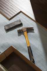 Image showing Hammer and Block with New Laminate Flooring