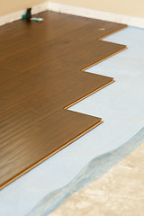 Image showing Newly Installed Brown Laminate Flooring