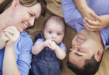 Image showing Mixed Race Family Playing on the Blanket