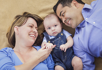 Image showing Mixed Race Family Playing on the Blanket