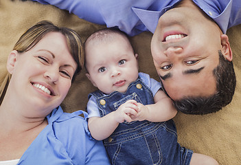 Image showing Mixed Race Family Playing on the Blanket