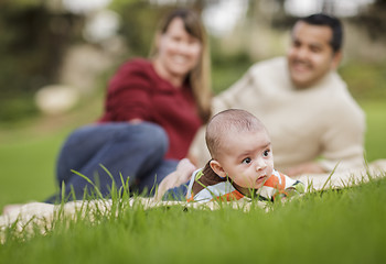 Image showing Happy Mixed Race Baby Boy and Parents Playing in Park