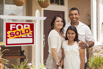 Image showing Hispanic Family in Front of Their New Home with Sold Sign