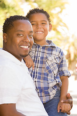 Image showing Happy Mixed Race Father and Son Playing