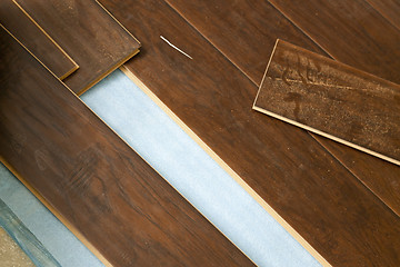 Image showing Newly Installed Brown Laminate Flooring