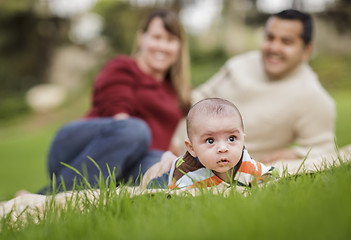 Image showing Happy Mixed Race Baby Boy and Parents Playing in Park