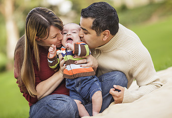 Image showing Happy Mixed Race Parents Playing with Their Son