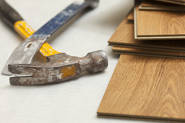 Image showing Hammer and Pry Bar with Laminate Flooring Abstract