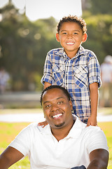 Image showing Happy Mixed Race Father and Son Playing