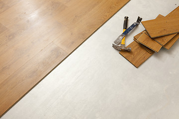 Image showing Hammer and Pry Bar with Laminate Flooring Abstract