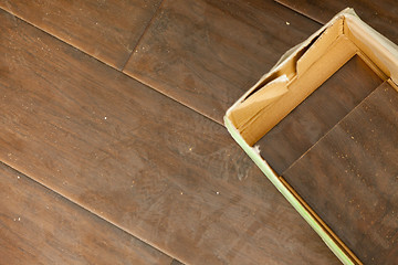 Image showing Newly Installed Brown Laminate Flooring