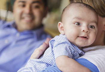 Image showing Happy Attractive Mixed Race Couple Burping Their Son