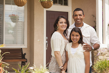 Image showing Small Hispanic Family in Front of Their Home