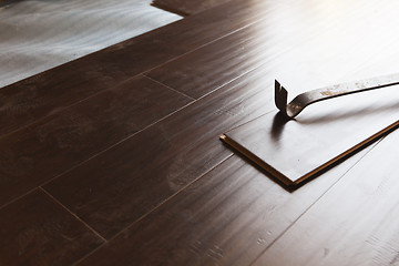 Image showing Pry Bar Tool with New Laminate Flooring
