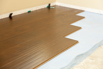 Image showing Newly Installed Brown Laminate Flooring