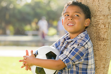 Image showing Mixed Race Boy Holding Soccer Ball in the Park